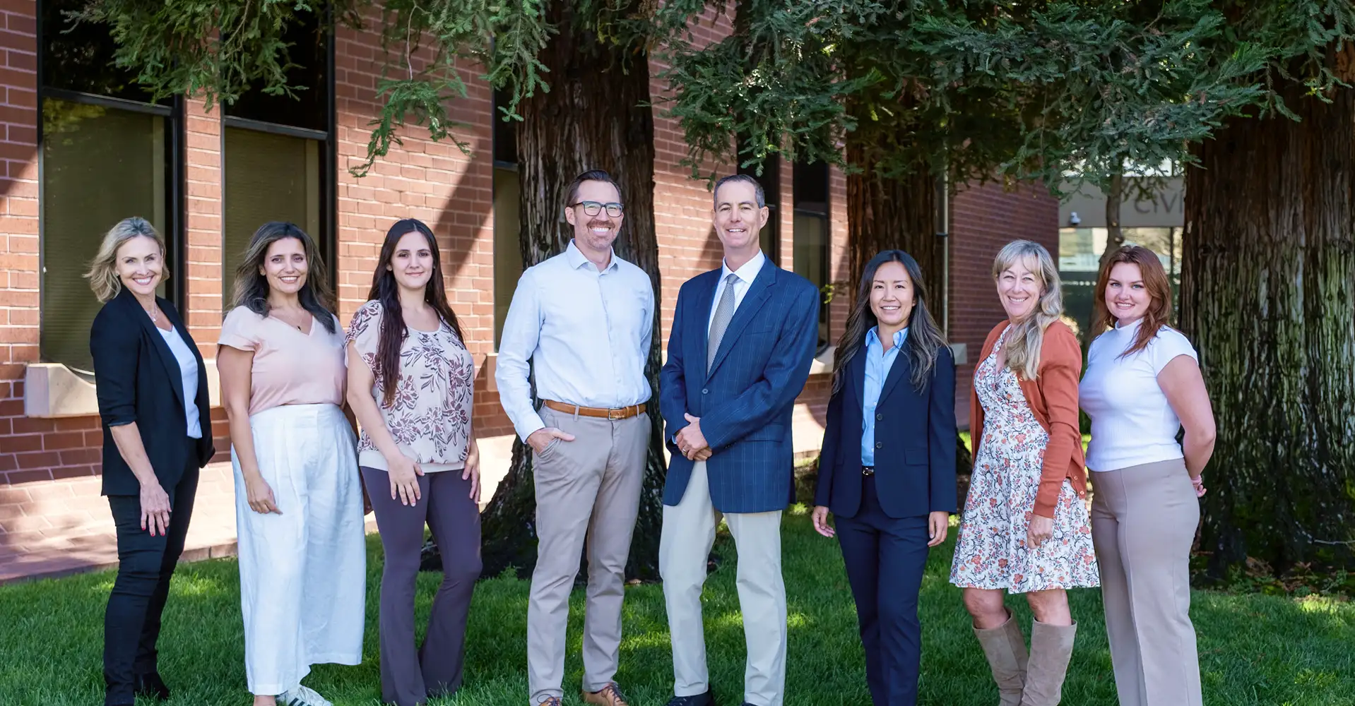 The Dental Implant Center at Walnut Creek team group photo all welcomely smiling and enjoying their time together