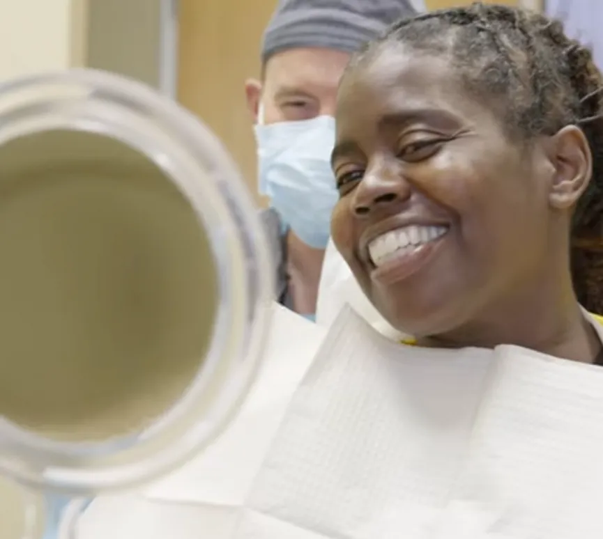 Woman smiling in a testimonial for Dental Implant Center at Walnut Creek