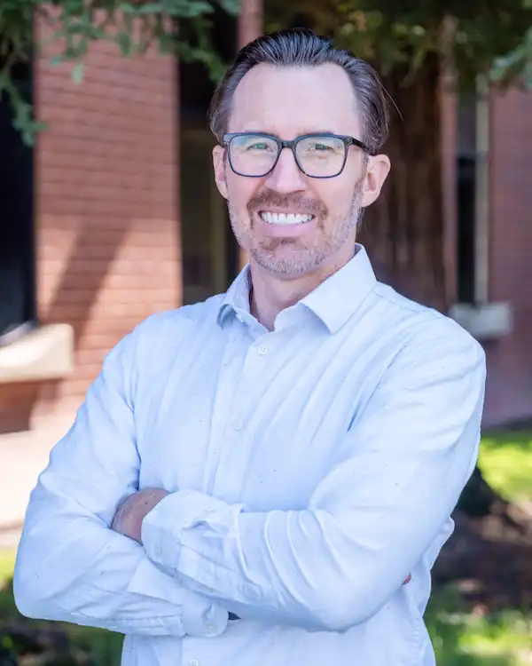 Dr. Quincy Gibbs Smiling outside of Dental Implant Center at Walnut Creek