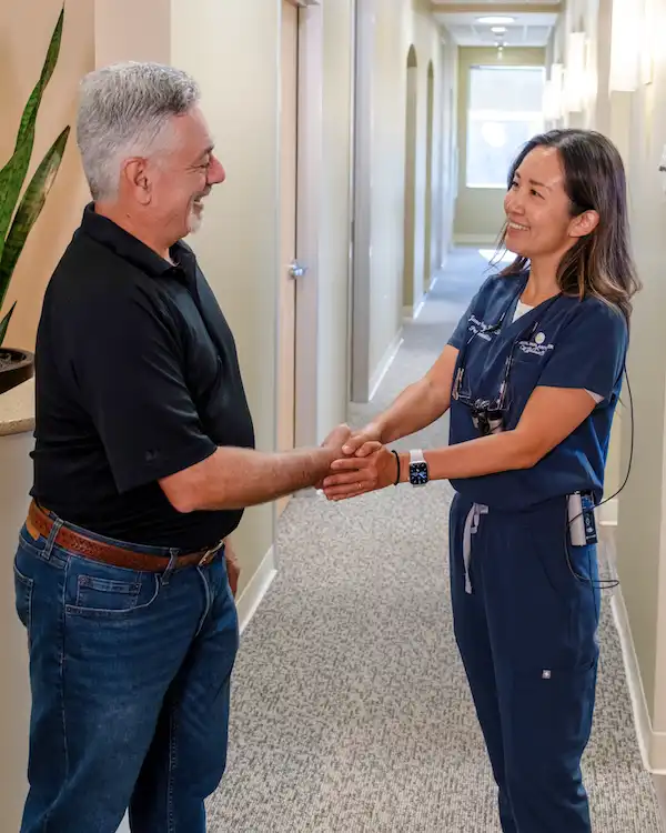 Dr. Wang greeting a Patient at Dental Implant Center at Walnut Creek