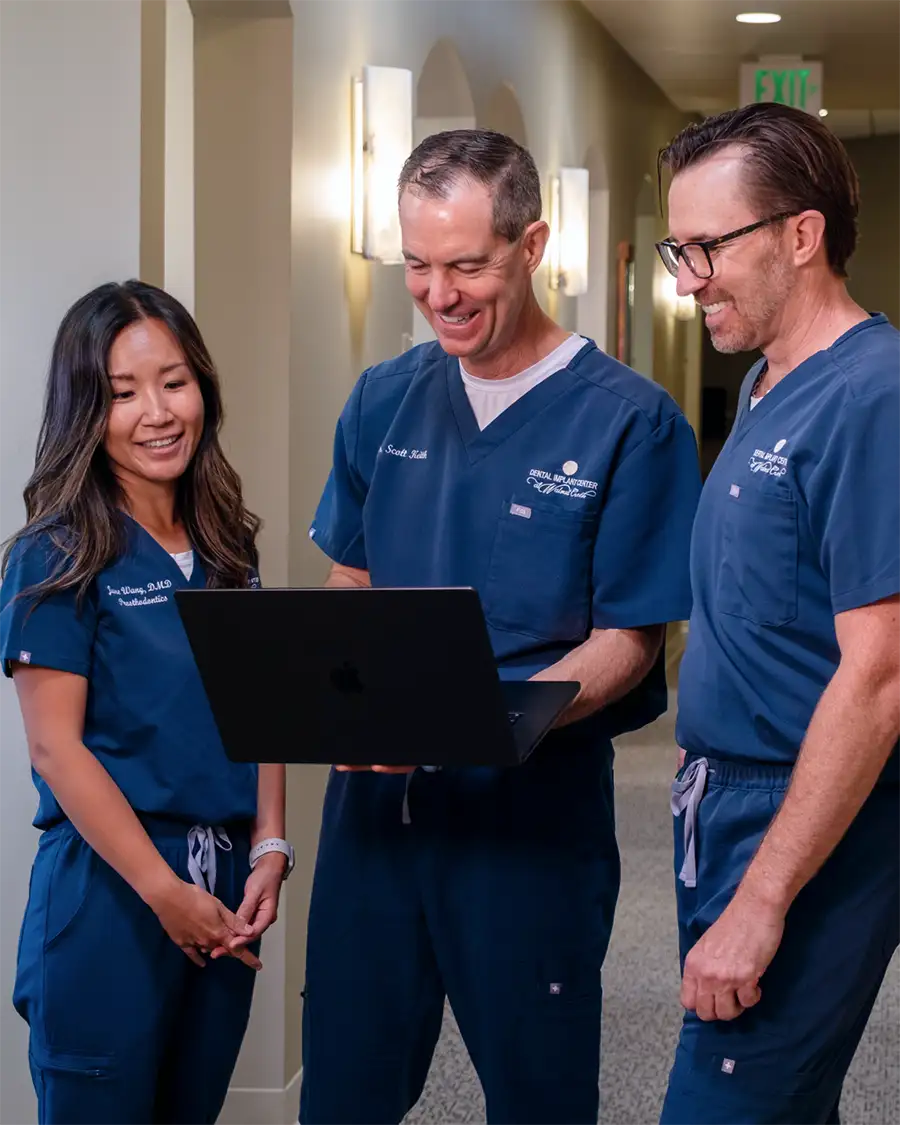 The doctors at The Dental Implant Center at Walnut Creek preparing for a new patient