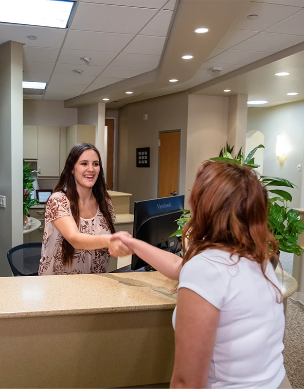 Greeting a patient at Dental Implant Center at Walnut Creek