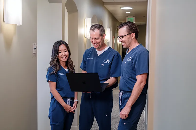 The doctors smiling and laughing