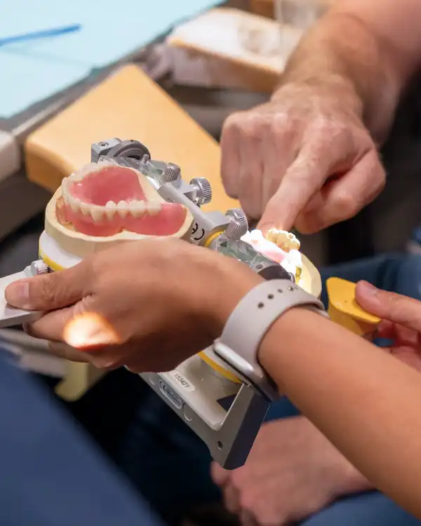 A hand holding prosthesis at Dental Implant Center at Walnut Creek in Walnut Creek, CA
