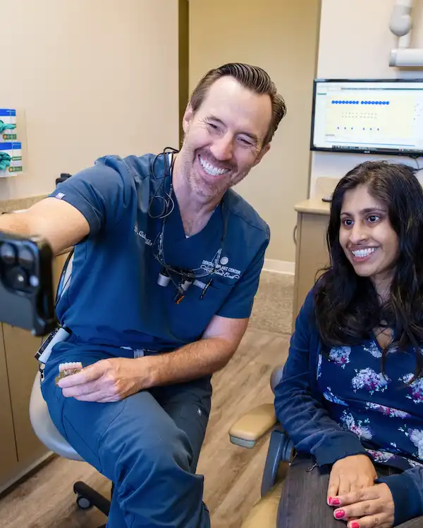 A Dr. Gibbs taking a selfie with a patient after Ridge Augmentation from Dental Implant Center at Walnut Creek in Walnut Creek, CA