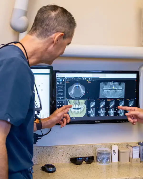 Dr. Keith looking at the x-ray of a patient with implants at Dental Implant Center at Walnut Creek in Walnut Creek, CA