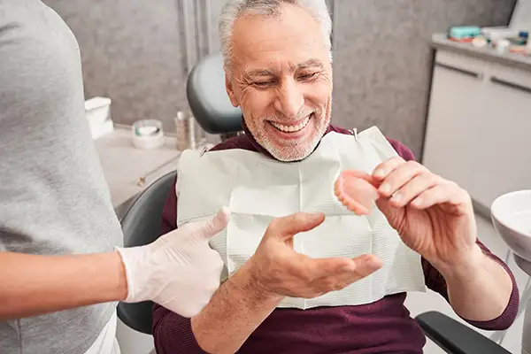 How Do Denture Creams Hold Dentures Still?